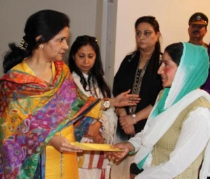 Chairperson PWWA, K Vijaya Rajendra interacting with family member of a martyr at Srinagar on Wednesday.