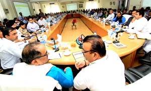 Dy Chief Minister, Dr Nirmal Singh and Minister for Industries, Chander Parkash Ganga chairing a board meeting at Kathua on Saturday.