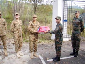 Army officials of India and Pakistan exchange sweets at Chakan-Da-Bagh in Poonch.