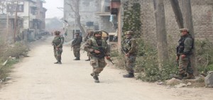 Troops in action after grenade blast at Pampore on Friday. — Excelsior/Younis Khaliq