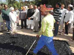 Provincial President NC, Devender Singh Rana launching macadamization of roads in Nagrota constituency on Saturday.
