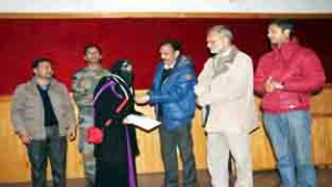 A participant of SANGAM-2015 being felicitated on day-3 of mega event on Monday.