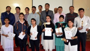 Winners of Inter-Collegiate Symposium and Poster Making Competition posing for a group photograph alongwith dignitaries at GDC Udhampur.  