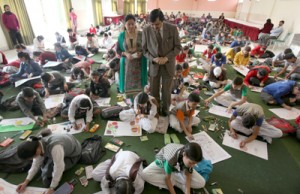 Students participating in a painting competition at Talab Tillo on Saturday. -Excelsior/ Rakesh