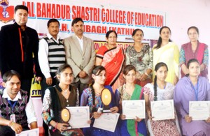 Winners of symposium posing for a group photograph in Kathua on Saturday.
