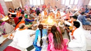 Yajnas in progress during ‘Ved Prachar’ programme in Arya Samaj Mandir, Bakshi Nagar in Jammu. -Excelsior/Rakesh