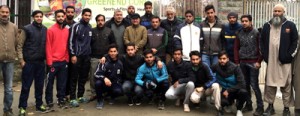 18-member team of Lone Star Kashmir Football Club posing for a group photograph alongwith the office bearers of the Club before leaving for Kamptee in Nagpur.