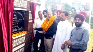 Speaker, Kavinder Gupta inaugurating a lane in Gandhi Nagar on Monday.
