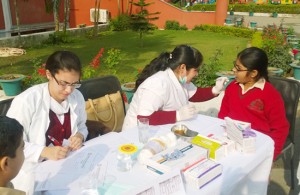 Doctors examining students during dental Camp at Banyan International School.