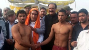 Wrestlers being felicitated by former Minister Surjit Singh Slathia at Vijaypur in Samba.