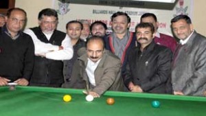 Javaid Ahmed Shah, Secretary State Sports Council aiming a shot while inaugurating State Billiards and Snooker Championship in Jammu on Saturday.—Excelsior/Rakesh