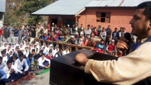 MLA Ramnagar R S Pathania addressing a public meeting at Basantgarh on Sunday.