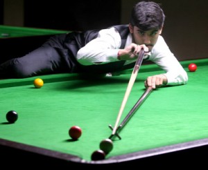 Cueist Anmol Abrol aiming a shot during a Sub Junior match at Billiards Hall, MA Stadium in Jammu on Sunday. —Excelsior/Rakesh