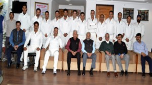 Members of JU’s Employees Cricket Team posing for a group photograph alongwith dignitaries during flag off ceremony in Jammu.   