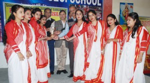Winners of Group Song Competition organized by Bharat Vikas Parishad receiving trophy from the chief guest and other dignitaries in Kathua.