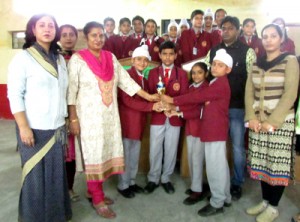 Winners of inter-house science quiz receiving prize from dignitaries.