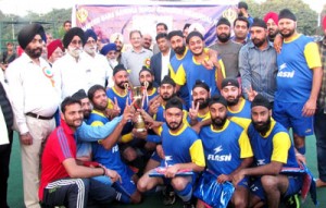 Winners of Hockey title posing for a group photograph alongwith chief guest, Kavinder Gupta and other dignitaries at KK Hakhu Astroturf Stadium in Jammu on Saturday. -Excelsior/ Rakesh