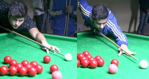 Cueists Divya and Shubneer aiming at target during a match of Junior Snooker District Championship at MA Stadium in Jammu.—Excelsior/Rakesh