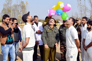 Chief guest tossing coin alongwith the captains while inaugurating Altaf Memorial Cricket Tournament in Pulwama.  