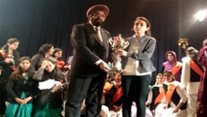 Atika Sharma student of Govt. Degree College (Boys) Kathua being presented trophy.