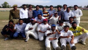 Jubilant players of GNCC showing victory signs while posing for a group photograph after their victory in All India T20 Cricket Tournament at MA Stadium in Jammu.