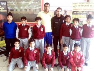 Winners of indoor cricket match posing for a group photograph at KCSC in Jammu on Monday.