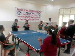 Players in action during a match of the Invitational Table Tennis Tournament at SMVDSB in Katra.