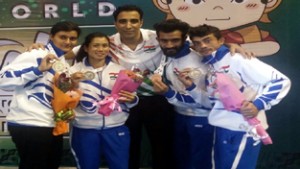 Surya Bhanu Partap Singh (second from right) posing for a group photograph alongwith other Indian medalists and National coach, Kuldeep Handoo at Kakarta in Indonesia during World Wushu Championship. 