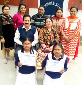 Winners of Quiz Competition posing for photograph alongwith Headmistress at GMS Railway Colony in Jammu.