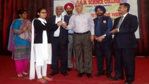 Winner of the seminar being felicitated at GGM Science College in Jammu on Friday. 