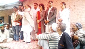 Prof Bhim Singh addressing gathering at Talwara camp on Thursday. 