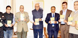 Governor N N Vohra releasing S N Pandit’s book at Raj Bhavan.