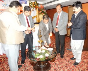 PCJ president Ashwani Kumar lighting ceremonial lamp to inaugurate media sensitization workshop at Jammu on Sunday. 
