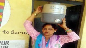 Water-woman working in Central Middle School Udhampur.