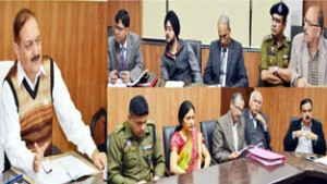 Divisional Commissioner Dr Pawan Kotwal chairing a meeting at Jammu on Monday.
