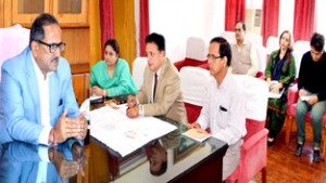 Dy Chief Minister, Dr Nirmal Singh chairing a meeting at Jammu on Tuesday.