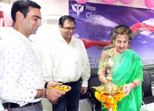 MLC Rani Blowria lighting ceremonial lamp to inaugurate hair transplant service at Max Clinics Jammu.  - Excelsior/Rakesh