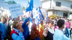 BSP activists taking out protest rally at Udhampur on Monday. 