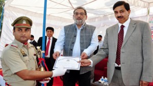 Finance Minister Dr Haseeb Drabu along with MoS Pawan Gupta presenting certificate to a pass out on Thursday. 