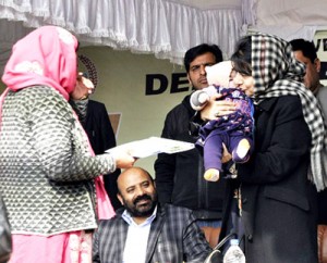 Minister for Social Welfare, Bali Bhagat and MP Mehbooba Mufti during launch of ‘Laadli Beti’ at Pulwama on Saturday.