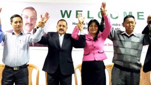 Union Minister Dr Jitendra Singh, flanked by contesting NDA candidates, during local municipal election campaign at Aizawl, Mizoram on Monday.