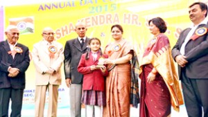 MoS for Education, Priya Sethi felicitating a girl student on Annual Day Function of Manu Shiksha Kendra Higher Secondary School at Kathua on Saturday.