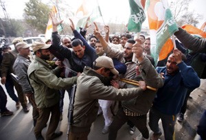 Police detaining activists of Indian Youth Congress (IYC) during a protest demonstration in Srinagar on Tuesday. -Excelsior/ Amin War