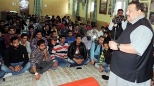 Provincial President NC, Devender Singh Rana addressing students during interactive session organised by NCSU at Sher-e-Kashmir Bhavan.