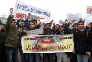 Activists of Gujjar Bakarwal Students Welfare Association and Gujjar Bakarwal Conference protesting in Srinagar on Monday. -Excelsior/ Amin War