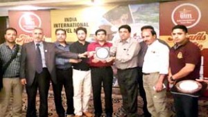 DGM, JKTDC, Ashwani Gupta and other delegates at India International Travel Mart, Pune posing for a photograph.