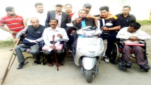 Disabled persons interacting with media persons at Jammu on Sunday.