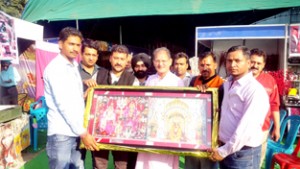 Speaker Legislative Assembly Kavinder Gupta being felicitated by organisers of trade-fair-cum-exhibition-cum-sale at Gandhi Nagar on Thursday