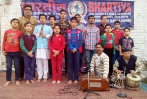 Artists of Bharatiya Lok Sangeet Kala Sansthan posing for a photograph on Saturday.