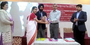 A digntary felicitating a student during a workshop at KV No 1, Gandhi Nagar, Jammu.